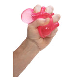 NeeDoh Nice Cube squishy i pink klemmes i hånden